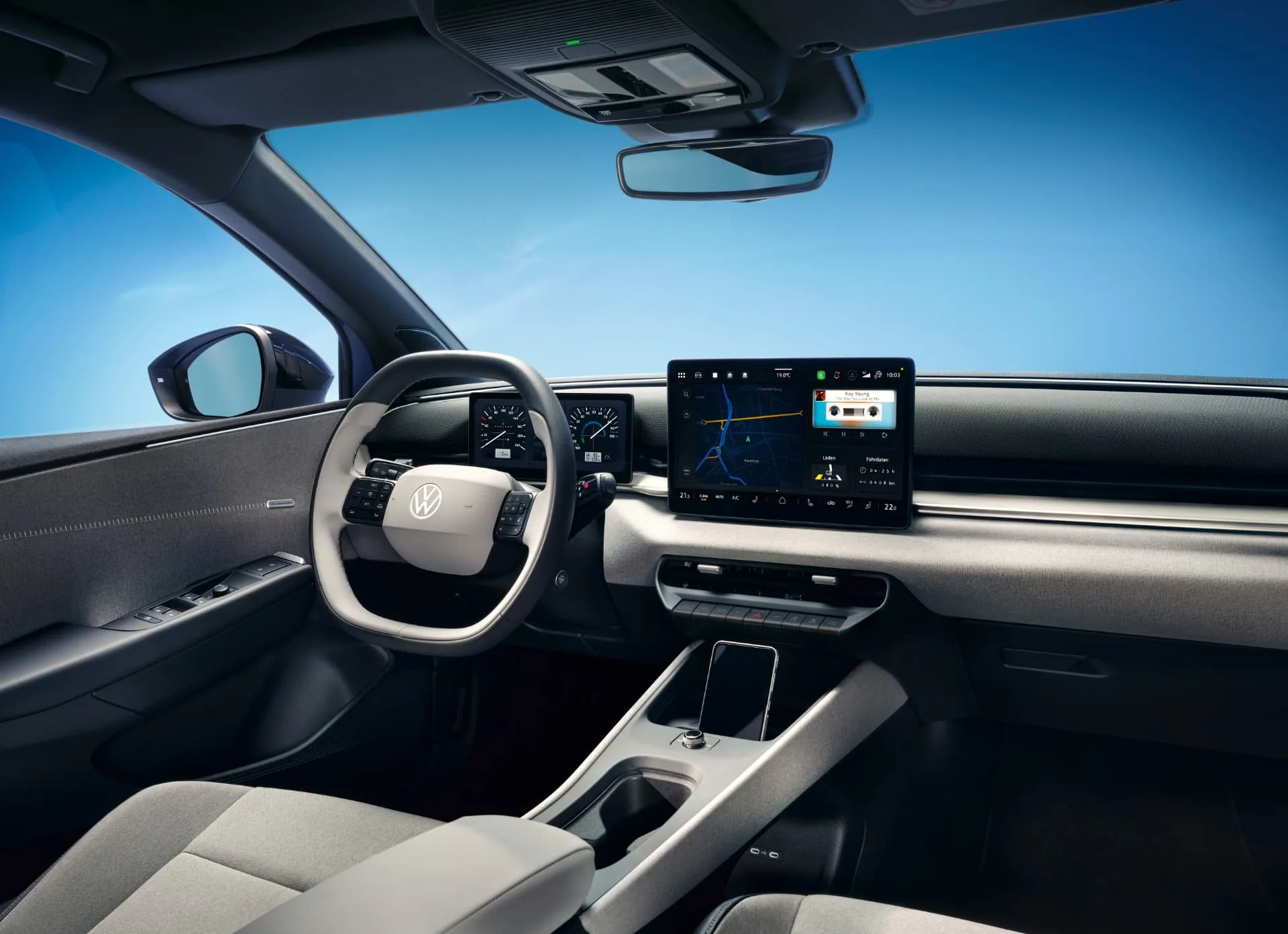 Interior of the Volkswagen ID. Polo showing the central touchscreen, driver display and physical controls