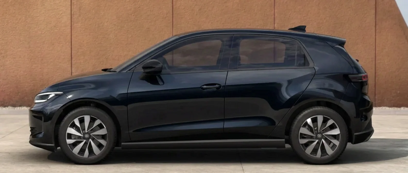 Side profile of the Volkswagen ID. Polo in a Grenadilla Black metallic finish